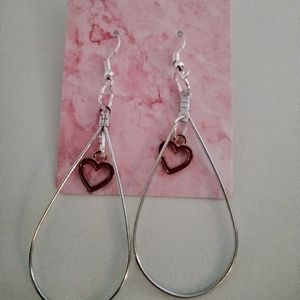 Red hearts inside of Sterling and silver teardrops